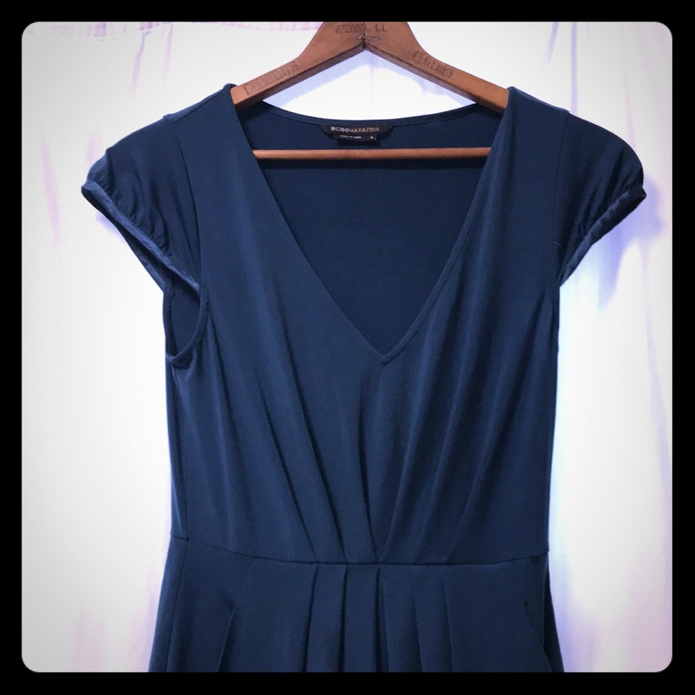 A jewel of a sleek dress with pockets!